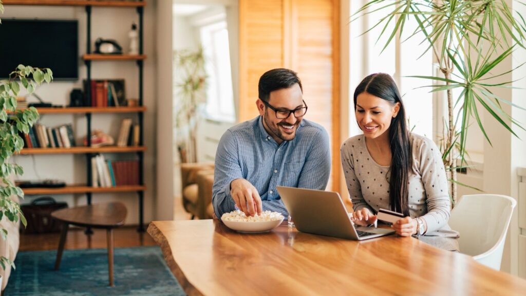 happy couple purchasing online