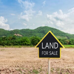 Land for sale sign on a plot of land